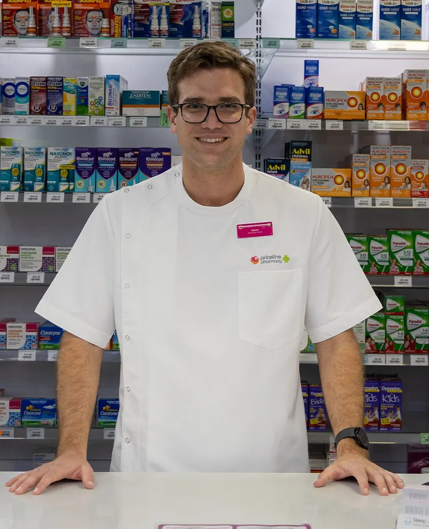 Jason Markey at the dispensary counter of Priceline Pharmacy Pacific Fair
